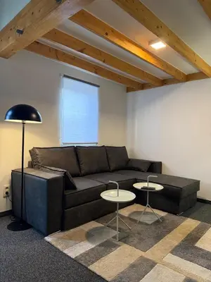 a living room with a couch and two tables at Cozy home in Zottegem in Zottegem
