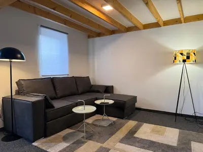 a living room with a couch and two tables at Cozy home in Zottegem in Zottegem