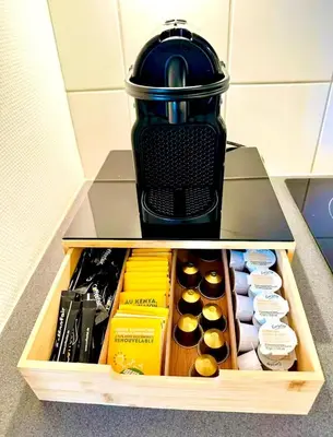 a coffee maker sitting on top of a drawer at Grand Place Bourse Prestige in Brussels