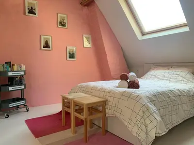 a bedroom with a bed with two teddy bears on it at Cozy loft in private house at the center of Ghent in Ghent