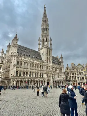a large building with a clock tower in a city at Centre ville de Bruxelles in Brussels