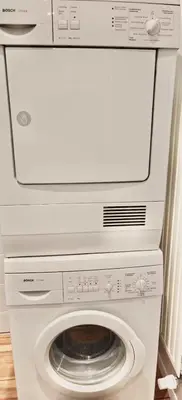 a washer and dryer in a room at Spacious terrace apartment in the heart of Brussels in Brussels