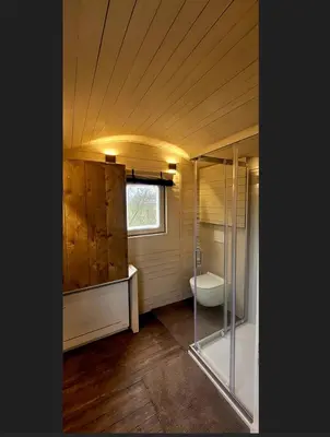 a bathroom with a shower and a sink and a toilet at BelleLiv in Nijlen