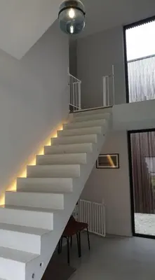 a white staircase in a room with a table at Tomorrowland2026 Basecamp in Mechelen