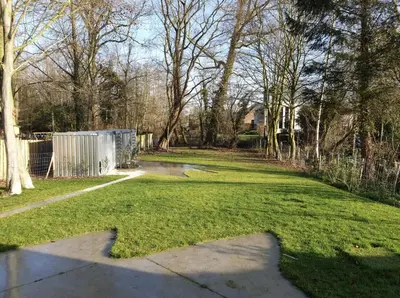 a grassy yard with a fence and a walkway at Tomorrowland2026 Basecamp in Mechelen