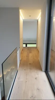 a hallway with a view of a room with a window at Tomorrowland2026 Basecamp in Mechelen
