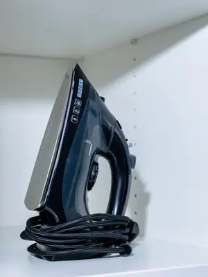 a iron sitting on top of a shelf at Cozy Studio - Downtown - 2 min from Metro - 201 in Brussels