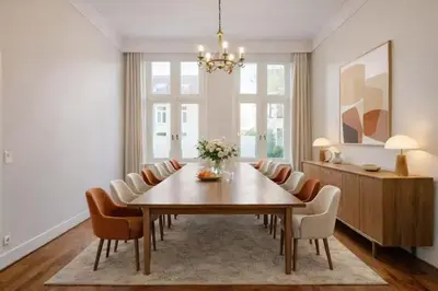 a dining room with a table and chairs at Luxury villa with pool for 14 people in Essen