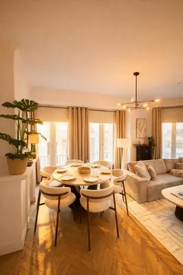 a living room with a table and chairs and a couch at Stay and Smile, Luxe stay in the heart of Antwerp in Antwerp