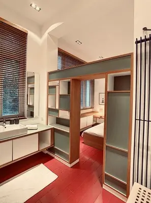 a large bathroom with a bed and a sink at Loft a stone's throw from Place Brugmann in Brussels