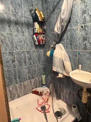 a bathroom with a bath tub and a sink at Appartement in Brussels