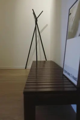 a wooden table with a windmill in a room at Design appartement met zonnig terras bij Gravensteen in Ghent