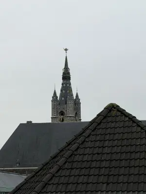 a tower on top of a building with a roof at Kaffee Changé in Ghent
