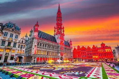 a city square with a clock tower in front of a building at Luma Residence in Brussels