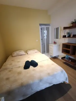 a bedroom with a bed with two hats on it at Duplex apartment in the center, best comfort in Brussels
