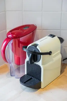 a toaster sitting on top of a kitchen counter at Prime Location Apartment Chtelain Saint-Gilles Self checkin in Brussels