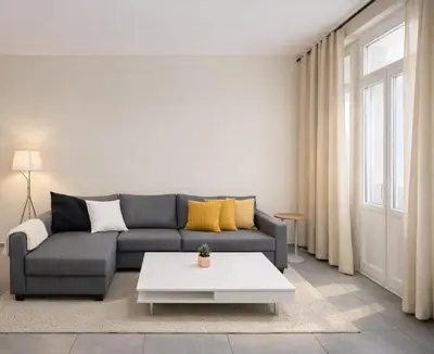 a living room with a couch and a table at Central Brussels Spacious 2BR near Grand Place 1 in Brussels