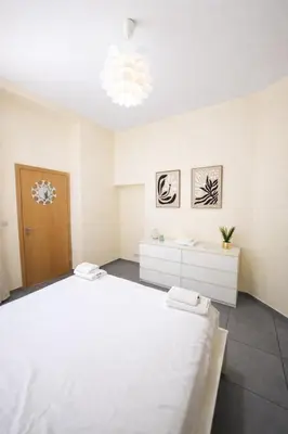 a large white room with a large bed at Central Brussels Spacious 2BR near Grand Place 1 in Brussels