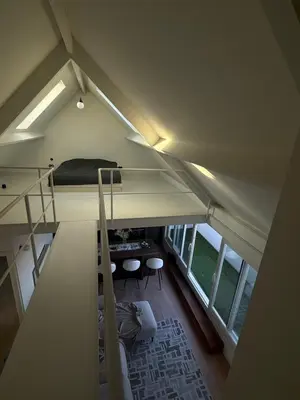 a room with a bunk bed and a loft at Amazing apartment with view in the centre in Antwerp
