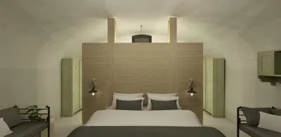 a bedroom with a large white bed at Erflogies Fort Liezele