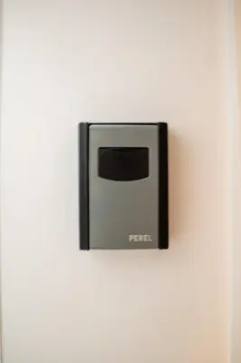 a black and white microwave on a white wall at Zoe's world in Brussels