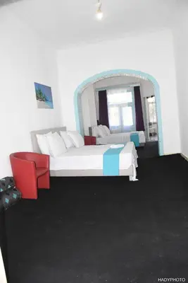 a bedroom with a large bed and a mirror at Hébergement touristique à Bruxelles capitale 2026 in Brussels