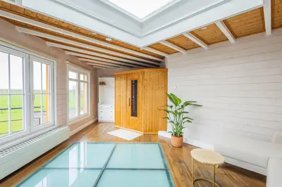 an empty living room with a glass floor at Bed & Port luxury villa in Kallo