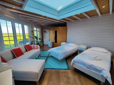 a living room with two beds and a couch at Bed & Port luxury villa in Kallo