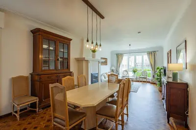 a dining room with a wooden table and chairs at Bed & Port luxury villa in Kallo