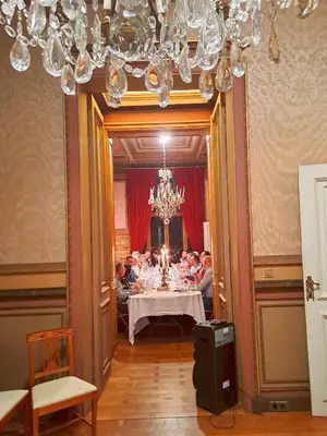 a group of people sitting at a table in a room at Maison Jamaer in Brussels
