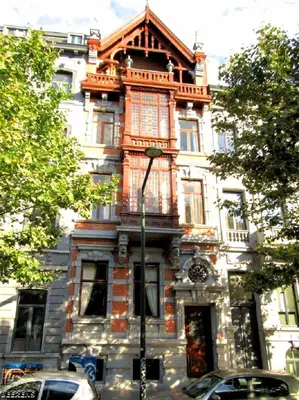 an old house with an ornate building on a street at Maison Jamaer in Brussels