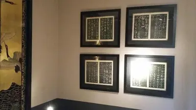 a wall with four windows in a room at Signature Designers Appartment in Brussels