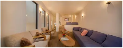 a living room with a couch and a table at Trip Inn Eden Antwerpen in Antwerp