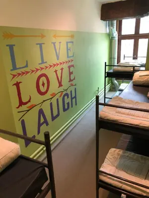 a room with several bunk beds with the words ive love jaight at Antwerp City Hostel in Antwerp