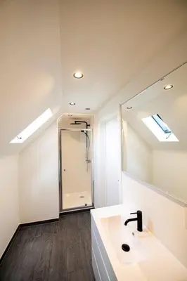 a bathroom with a sink and a mirror at De Blauwe Hoeve in Zwijndrecht