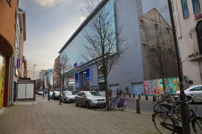 a city street with cars parked on the street at ATW Apartments in Antwerp