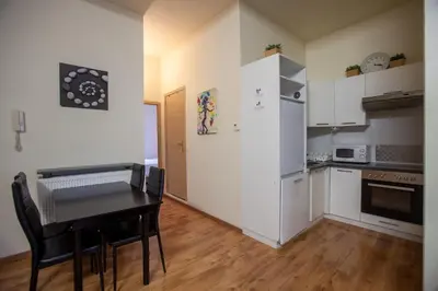 a small kitchen with a table and a refrigerator at ATW Apartments in Antwerp