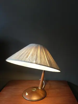 a lamp sitting on top of a wooden table at Baeten's bed and breakfast in Ghent