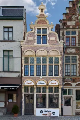 a large brick building with a tower on top at De Waterzooi Lodge in Ghent