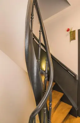 a metal spiral staircase in a house at Hotel Agora Brussels Grand Place in Brussels