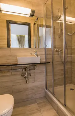 a bathroom with a sink and a shower at Hotel Agora Brussels Grand Place in Brussels