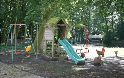 a playground with a slide and a play structure at Kasteel Ter Leyen in Boekhoute