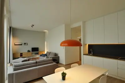 a living room with a couch and a table at Cadix 35 in Antwerp
