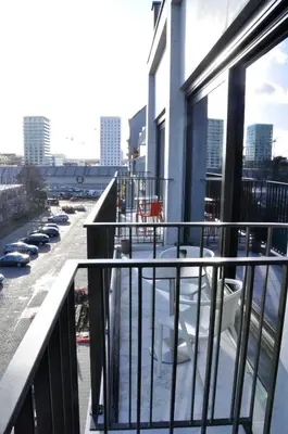 a balcony with cars parked in a parking lot at Cadix 35 in Antwerp
