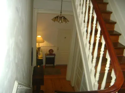 a hallway with a stairway leading to a room at Résidence18 in Brussels