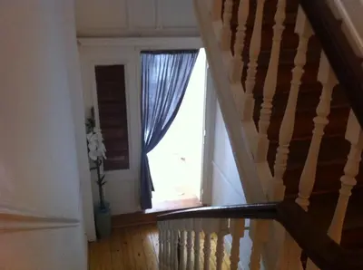 a staircase leading to a window in a house at Résidence18 in Brussels