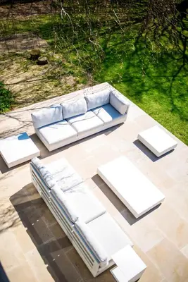 a white couch sitting on top of a patio at Aquarand in Hofstade