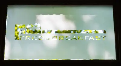 a glass window with the words forbidden breakfast on it at Fred&Breakfast in Ghent