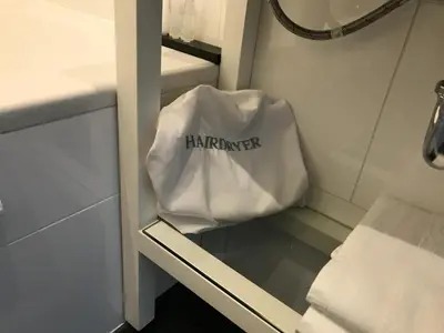 a white bag with the word farmont written on it at Antwerp Business Suites in Antwerp
