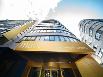 a large building with a sign on it at Maek Hotel Antwerp Central - Handwritten Collection by Accor in Antwerp